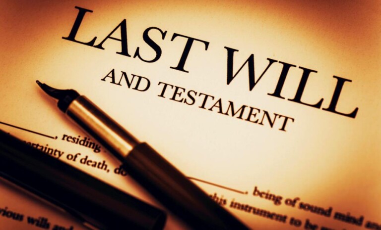 Photo of a last will and testament document with a pen